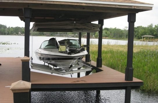 Automatic Boat Cover in a boat house on a Florida Lake