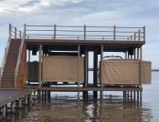 Two Touchless Boat Covers, side by side, lake dock. No snaps or straps, automatic boat cover